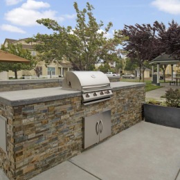 a stone wall with a stone wall and a brick wall with a brick wall and trees and a