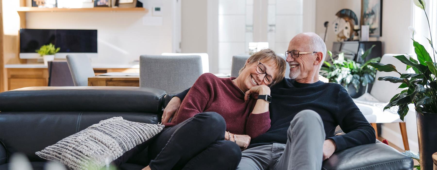 a man and woman sitting on a couch